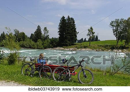 "Cyclists during a break at the Lech river, Way of St James, Lechbruck am See, Swabia, Bavaria, Germany, Europe" View Large Photo Image Stock Photo - "Cyclists during a break at the Lech river, Way of St James, Lechbruck am See, Swabia, Bavaria, Germany, Europe". Fotosearch