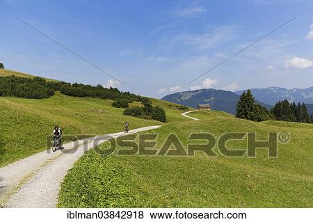 "Cyclists on a dirt road, Eggatsbergvorsass near Schetteregg, Bregenz Forest, Vorarlberg, Austria, Europe" View Large Photo Image Stock Photo - "Cyclists on a dirt road, Eggatsbergvorsass near Schetteregg, Bregenz Forest, Vorarlberg, Austria, Europe". Fotosearch