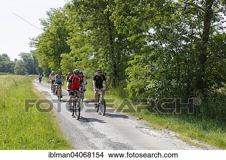 "Cyclists on Lafnitztal bike path, Heiligenkreuz im Lafnitztal, Southern Burgenland, Burgenland, Austria, Europe" View Large Photo Image Picture - "Cyclists on Lafnitztal bike path, Heiligenkreuz im Lafnitztal, Southern Burgenland, Burgenland, Austria, Europe". Fotosearch