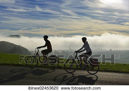 "Cyclists riding electric bicycles on Tannberg Mountain, Koestendorf, Lake Waller, Salzburg Lake District, Salzburg, Austria, Europe" View Large Photo Image Stock Image - "Cyclists riding electric bicycles on Tannberg Mountain, Koestendorf, Lake Waller, Salzburg Lake District, Salzburg, Austria, Europe". Fotosearch
