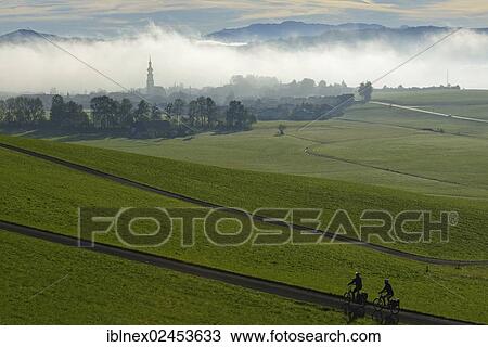 "Cyclists riding electric bicycles on Tannberg Mountain, Koestendorf, Lake Waller, Salzburg Lake District, Salzburg, Austria, Europe" View Large Photo Image Stock Image - "Cyclists riding electric bicycles on Tannberg Mountain, Koestendorf, Lake Waller, Salzburg Lake District, Salzburg, Austria, Europe". Fotosearch