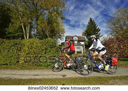 "Cyclists riding electric bicycles, Matzing, Lake Waller, Neumarkt, Salzburg Lake District, Salzburg, Austria, Europe" View Large Photo Image Stock Image - "Cyclists riding electric bicycles, Matzing, Lake Waller, Neumarkt, Salzburg Lake District, Salzburg, Austria, Europe". Fotosearch
