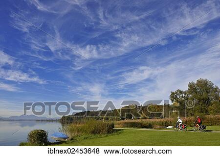 "Cyclists riding electric bicycles, Matzing, Lake Waller, Neumarkt, Salzburg Lake District, Salzburg, Austria, Europe" View Large Photo Image Stock Photo - "Cyclists riding electric bicycles, Matzing, Lake Waller, Neumarkt, Salzburg Lake District, Salzburg, Austria, Europe". Fotosearch