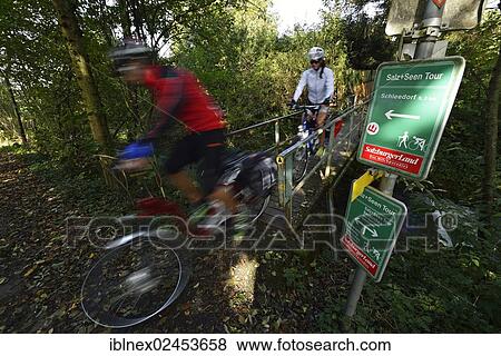 "Cyclists riding electric bicycles, Weng, Lake Waller Circular Tour, Salt and Lakes Tour, Salzburg Lake District, Salzburg, Austria, Europe" View Large Photo Image Stock Photo - "Cyclists riding electric bicycles, Weng, Lake Waller Circular Tour, Salt and Lakes Tour, Salzburg Lake District, Salzburg, Austria, Europe". Fotosearch