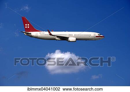 Stock Image - "D-APBB PrivatAir Boeing 737, in flight". Fotosearch