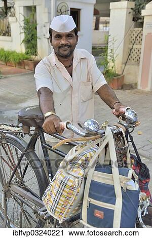 "Dabba wallah or food delivery man with the typical white cap and bags full of food, Mumbai, Maharashtra, India, Asia" View Large Photo Image Stock Image - "Dabba wallah or food delivery man with the typical white cap and bags full of food, Mumbai, Maharashtra, India, Asia". Fotosearch