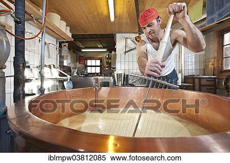 "Dairyman mixing the whey and the curd with a cheese harp in a copper kettle, Alp Gun, Graubunden, Switzerland, Europe" View Large Photo Image Stock Photography - "Dairyman mixing the whey and the curd with a cheese harp in a copper kettle, Alp Gun, Graubunden, Switzerland, Europe". Fotosearch