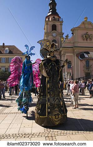 "Dancers walking on stilts wearing colorful costumes, Venezianische Messe, Venetian festival, Ludwigsburg, Baden-Wuerttemberg, Germany, Europe" View Large Photo Image Stock Image - "Dancers walking on stilts wearing colorful costumes, Venezianische Messe, Venetian festival, Ludwigsburg, Baden-Wuerttemberg, Germany, Europe". Fotosearch