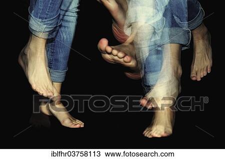 Stock Image - "Dancing feet against black, multiple exposure, Grevenbroich, North Rhine-Westphalia, Germany, Europe". Fotosearch