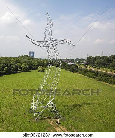 Stock Photo - "Dancing high voltage transmission tower, """"Sorcerer's Apprentice"""", art work by the Berlin artist group Inges Idee, Emscherkunst 2013, Oberhausen, North Rhine-Westphalia, Germany, Europe". Fotosearch