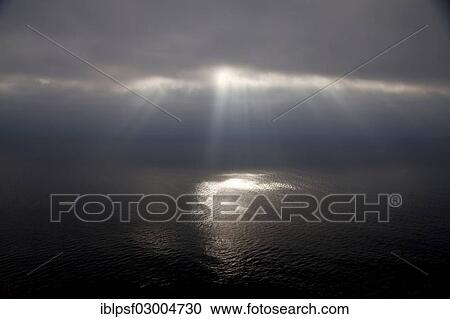 "Dark clouds and sun rays over the Pacific Ocean, Big Sur, California, United States, North America" View Large Photo Image Stock Image - "Dark clouds and sun rays over the Pacific Ocean, Big Sur, California, United States, North America". Fotosearch