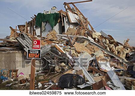 "Debris from destruction of a seaside community by Hurricane Sandy, one homeowner has posted """"no trespassing"""" signs around the rubble pile of his former home, Union Beach, New Jersey, United States, North America" View Large Photo Image Stock Photography - "Debris from destruction of a seaside community by Hurricane Sandy, one homeowner has posted """"no trespassing"""" signs around the rubble pile of his former home, Union Beach, New Jersey, United States, North America". Fotosearch