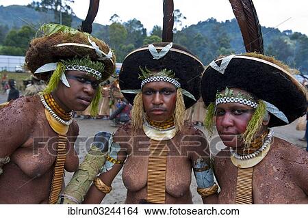 Picture - "Decorated and painted women celebrating the traditional Sing Sing in the highlands, Enga, Highlands, Papua New Guinea, Oceania". Fotosearch