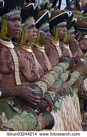 "Decorated and painted women celebrating the traditional Sing Sing in the highlands, Enga, Highlands, Papua New Guinea, Oceania" View Large Photo Image Picture - "Decorated and painted women celebrating the traditional Sing Sing in the highlands, Enga, Highlands, Papua New Guinea, Oceania". Fotosearch