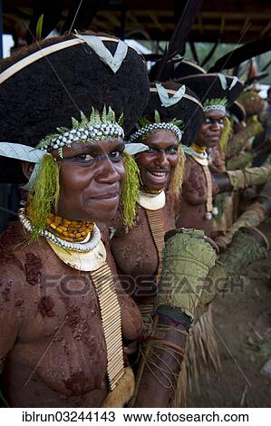 "Decorated and painted women celebrating the traditional Sing Sing in the highlands, Enga, Highlands, Papua New Guinea, Oceania" View Large Photo Image Stock Image - "Decorated and painted women celebrating the traditional Sing Sing in the highlands, Enga, Highlands, Papua New Guinea, Oceania". Fotosearch