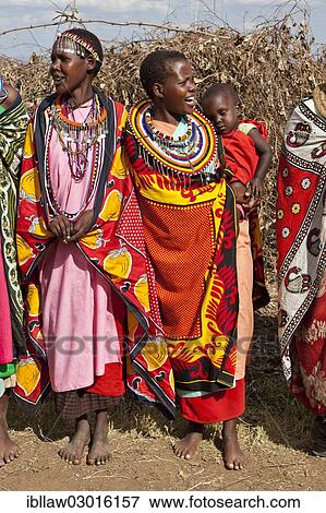 "Decorated Maasai women wearing traditional dress, Massai Mara, Distrikt Narok, Serengeti, Rift Valley province, Kenya, Africa" View Large Photo Image Stock Photo - "Decorated Maasai women wearing traditional dress, Massai Mara, Distrikt Narok, Serengeti, Rift Valley province, Kenya, Africa". Fotosearch