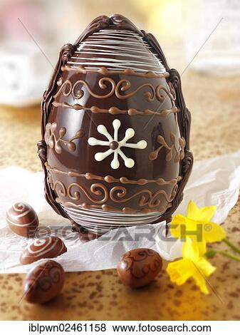 Stock Photo - Decorated traditional milk chocolate Easter egg. Fotosearch