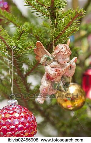 Decorative angel in Christmas tree View Large Photo Image Stock Photo - Decorative angel in Christmas tree. Fotosearch