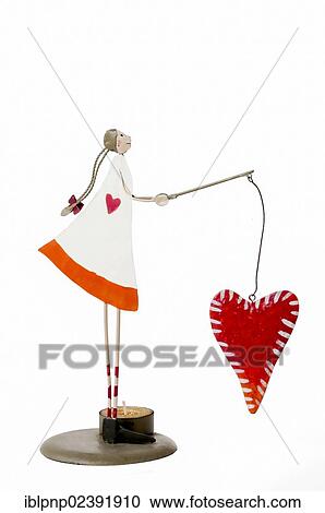 "Decorative figurine, girl fishing heart" View Large Photo Image Stock Image - "Decorative figurine, girl fishing heart". Fotosearch
