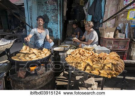Picture - "Deep fried snacks at a food stall, Jaipur, Rajasthan, India, Asia". Fotosearch