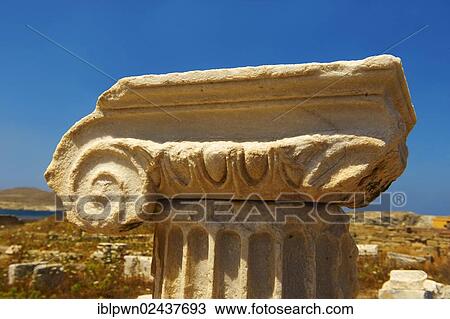 Stock Image - "Delphic column capital of the ruins of the Greek city of Delos, Cyclades Islands, Greece, Europe". Fotosearch