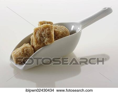 "Demerara sugar, cane sugar, coarse sugar cubes" View Large Photo Image Picture - "Demerara sugar, cane sugar, coarse sugar cubes". Fotosearch