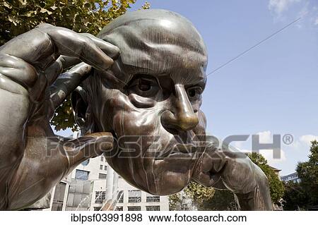 Stock Photo - "Denkpartner"""" bronze sculpture by the Swiss sculptor Hans-Jorg Limbach, in front of Friedrichsbau building in Borsenplatz square, Stuttgart, Baden-Wurttemberg, Germany, Europe". Fotosearch