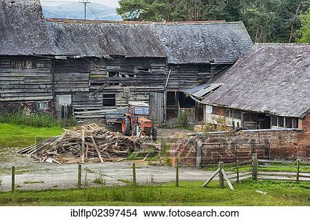 "Derelict farmyard with old farm buildings and tractor, Newtown, Powys, Wales, United Kingdom, Europe" View Large Photo Image Picture - "Derelict farmyard with old farm buildings and tractor, Newtown, Powys, Wales, United Kingdom, Europe". Fotosearch