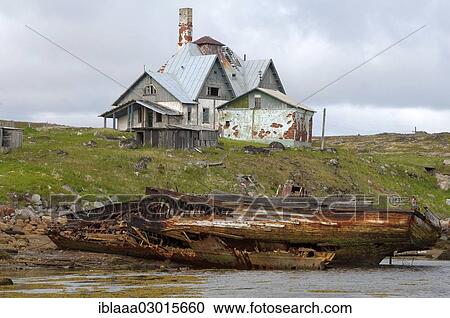 "Derelict small fishing boat, MRB, in front of a derelict house in a rural locality on the Barents Sea, Dalniye Zelentsy, Kola Peninsula, Kolsky District, Murmansk Oblast, Russia, Europe" View Large Photo Image Stock Image - "Derelict small fishing boat, MRB, in front of a derelict house in a rural locality on the Barents Sea, Dalniye Zelentsy, Kola Peninsula, Kolsky District, Murmansk Oblast, Russia, Europe". Fotosearch