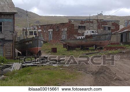 "Derelict small fishing boats, MRB, in front of derelict houses in a rural locality, Dalniye Zelentsy, Kola Peninsula, Kolsky District, Murmansk Oblast, Russia, Europe" View Large Photo Image Stock Image - "Derelict small fishing boats, MRB, in front of derelict houses in a rural locality, Dalniye Zelentsy, Kola Peninsula, Kolsky District, Murmansk Oblast, Russia, Europe". Fotosearch