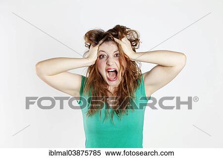 Desperate young woman tearing her hair View Large Photo Image Stock Photography - Desperate young woman tearing her hair. Fotosearch