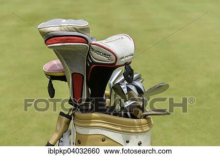 Stock Image - "Detail view, golf bag with clubs on the green, Hua Hin, Thailand, Asia". Fotosearch