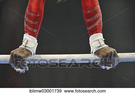 Stock Photo - "Detail view, hands on uneven bars, Elizabeth PRICE, USA, EnBW Gymnastics World Cup 2012, Porsche-Arena, Stuttgart, Baden-Wurttemberg, Germany, Europe". Fotosearch