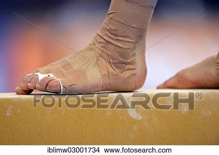 Picture - "Detail view of a bandaged foot, balance beam, EnBW Gymnastics World Cup 2012, Porsche-Arena, Stuttgart, Baden-Wurttemberg, Germany, Europe". Fotosearch
