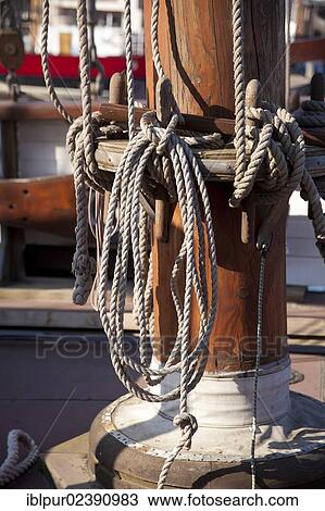 "Detail view of ropes of a small sailing ship in the harbour of Greifswald, Mecklenburg-Western Pomerania, Germany, Europe" View Large Photo Image Stock Image - "Detail view of ropes of a small sailing ship in the harbour of Greifswald, Mecklenburg-Western Pomerania, Germany, Europe". Fotosearch