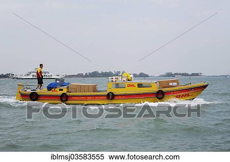 Stock Photography - "DHL packet vessel delivering parcels, Venice, Venezien, Italy, Europe". Fotosearch