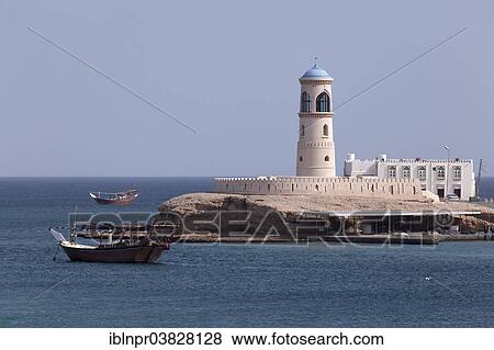 "Dhow-ship in front of a lighthouse, Al Ayjah, Sur, Ash Sharqiyah province, Sultanate of Oman, Arabian Peninsula" View Large Photo Image Stock Photo - "Dhow-ship in front of a lighthouse, Al Ayjah, Sur, Ash Sharqiyah province, Sultanate of Oman, Arabian Peninsula". Fotosearch