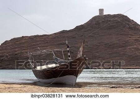 "Dhow-ship in the harbour of Sur, in front of a rocky hill with a defence tower, Ash Sharqiyah province, Sultanate of Oman, Arabian Peninsula" View Large Photo Image Stock Image - "Dhow-ship in the harbour of Sur, in front of a rocky hill with a defence tower, Ash Sharqiyah province, Sultanate of Oman, Arabian Peninsula". Fotosearch