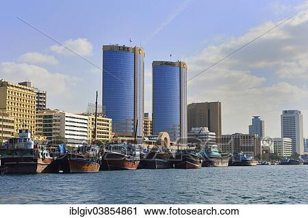 "Dhows on the banks of Dubai Creek, in front of Deira, Dubai, United Arab Emirates, Asia" View Large Photo Image Stock Image - "Dhows on the banks of Dubai Creek, in front of Deira, Dubai, United Arab Emirates, Asia". Fotosearch