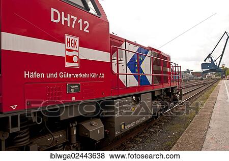"Diesel-hydraulic locomotive, for routes and shunting with hydraulic power transmission, manufacturer Vossloh, G 1000 BB series, built in 2002, Westkai terminal, Cologne-Niehl, North Rhine-Westphalia, Germany,, Europe" View Large Photo Image Stock Photo - "Diesel-hydraulic locomotive, for routes and shunting with hydraulic power transmission, manufacturer Vossloh, G 1000 BB series, built in 2002, Westkai terminal, Cologne-Niehl, North Rhine-Westphalia, Germany,, Europe". Fotosearch