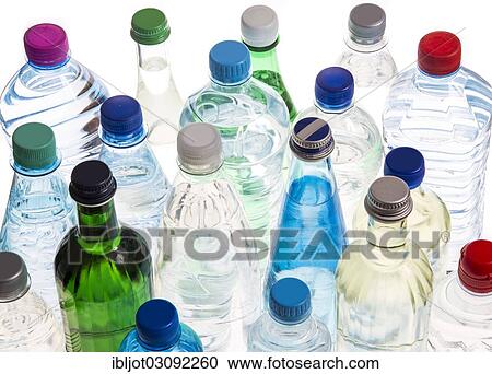 Stock Image - Different varieties of mineral water in bottles made of glass and plastic or PET. Fotosearch