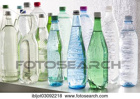 Different varieties of mineral water in bottles made of glass and plastic or PET View Large Photo Image Stock Photo - Different varieties of mineral water in bottles made of glass and plastic or PET. Fotosearch
