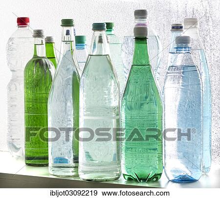 Different varieties of mineral water in bottles made of glass and plastic or PET View Large Photo Image Stock Photo - Different varieties of mineral water in bottles made of glass and plastic or PET. Fotosearch