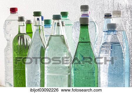 Different varieties of mineral water in bottles made of glass and plastic or PET View Large Photo Image Stock Photograph - Different varieties of mineral water in bottles made of glass and plastic or PET. Fotosearch