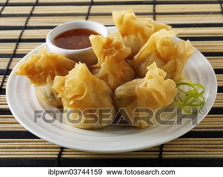 Dim sum with a chilli dipping sauce View Large Photo Image Stock Photo - Dim sum with a chilli dipping sauce. Fotosearch