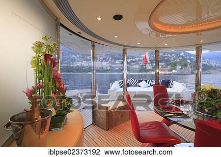 "Dining area on the main deck, Leonardo II, a cruiser built by Azimut, type of boat: Leonardo 98, length: 30. 15 m, built in 2004, French Riviera, France, Mediterranean Sea, Europe" View Large Photo Image Stock Image - "Dining area on the main deck, Leonardo II, a cruiser built by Azimut, type of boat: Leonardo 98, length: 30. 15 m, built in 2004, French Riviera, France, Mediterranean Sea, Europe". Fotosearch