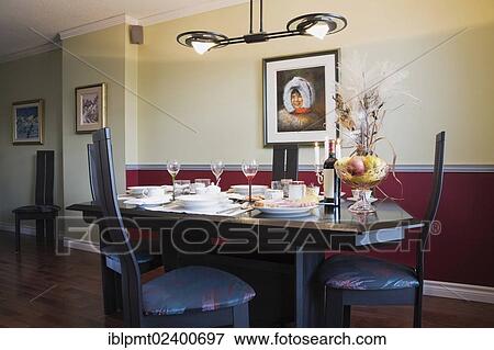 "Dining room table and chairs inside a residential condominium apartment building, Quebec, Canada, property released for commercial use, North America" View Large Photo Image Stock Photo - "Dining room table and chairs inside a residential condominium apartment building, Quebec, Canada, property released for commercial use, North America". Fotosearch