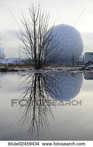 Picture - "Discarded radar dome, radome, reflected in the water on a former military site, Mietraching, Bavaria, Germany, Europe". Fotosearch