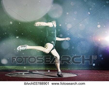 Discus thrower spinning before a throw View Large Photo Image Stock Image - Discus thrower spinning before a throw. Fotosearch