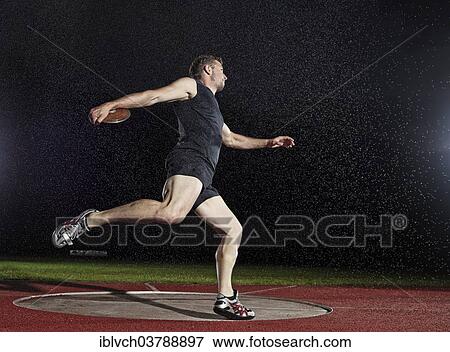Stock Photo - Discus thrower spinning before a throw. Fotosearch